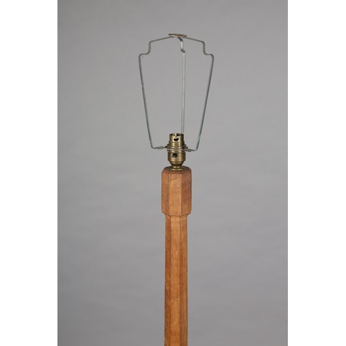 351 - A THOMPSON OF KILBURN 'MOUSEMAN', an oak standard lamp, the tapered column on an octagonal stepped b... 