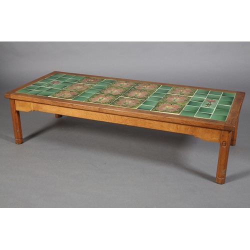 355 - AN OAK COFFEE TABLE, Acorn Man, inset with Art Nouveau green and mauve tiles, rectangular, on octago... 