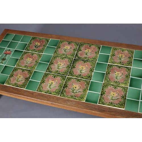 355 - AN OAK COFFEE TABLE, Acorn Man, inset with Art Nouveau green and mauve tiles, rectangular, on octago... 