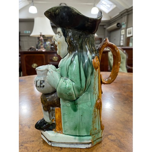 80 - AA RALPH WOOD TYPE PEARLWARE TOBY JUG C1790-1800 of typical form, glazed in green, brown and umber, ... 