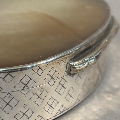 43 - A late 19th century silver and mother of pearl; snuff box, oval, the sides embossed with a trellis p... 