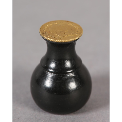 57 - An ebony seal with a George III one-third Guinea Matrix (the coin c1797-1813), 3cm high (Shipping ca... 