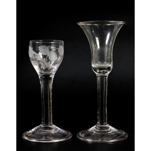 60 - An 18th century wine glass, c1780, the ogee bowl etched with flower and leaves, on plain stem, domed... 