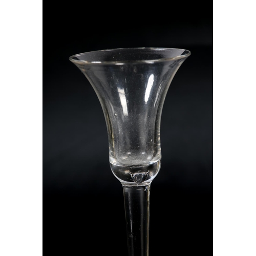 60 - An 18th century wine glass, c1780, the ogee bowl etched with flower and leaves, on plain stem, domed... 