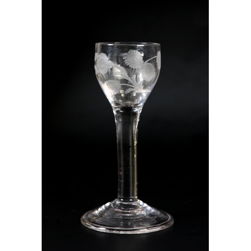 60 - An 18th century wine glass, c1780, the ogee bowl etched with flower and leaves, on plain stem, domed... 