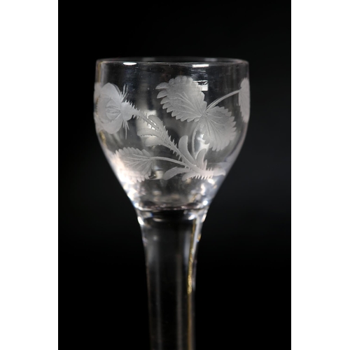 60 - An 18th century wine glass, c1780, the ogee bowl etched with flower and leaves, on plain stem, domed... 