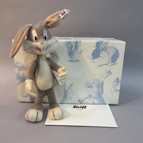 124 - A Steiff mohair plush figure of Warner Bros Cartoon’s ‘Bugs Bunny’, number 927 of 2000, 26cm high, b... 