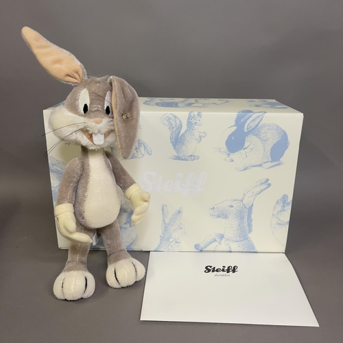 143 - A Steiff mohair plush figure of Warner Bros Cartoon’s ‘Bugs Bunny’, number 929 of 2000, 26cm high, b... 