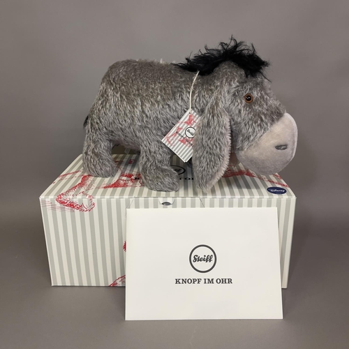 147 - A Steiff mohair plush figure of ‘Eeyore’ from Disney’s cartoon Winnie the Pooh, number 777 of 2000, ... 