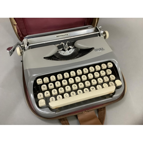 120 - A vintage typewriter by Royalite in two tone grey metal frame and with carrying case