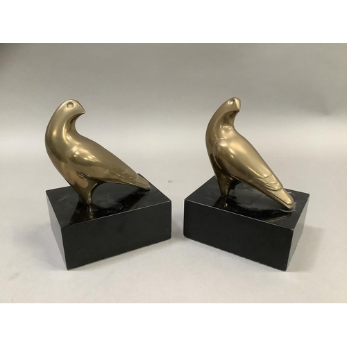 13 - A pair of brass hawk bookends on ebonised, rectangular plinths, 13cm wide x 10cm deep x18cm high