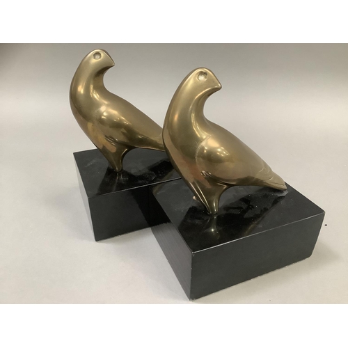 13 - A pair of brass hawk bookends on ebonised, rectangular plinths, 13cm wide x 10cm deep x18cm high