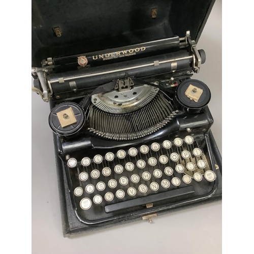 66 - A Vintage Underwood Standard portable typewriter black enamelled with gilt lettering complete with c... 