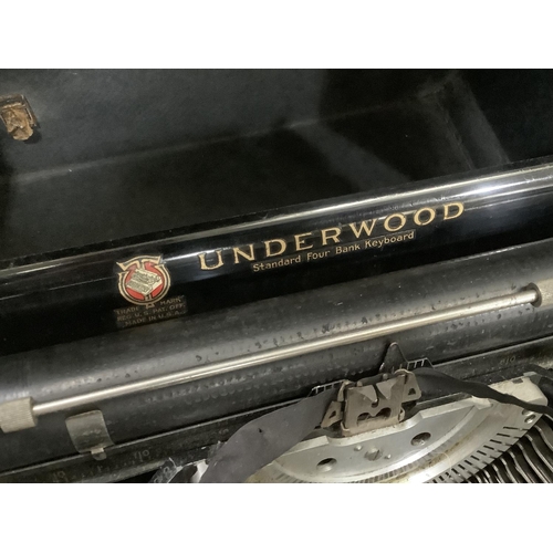 66 - A Vintage Underwood Standard portable typewriter black enamelled with gilt lettering complete with c... 