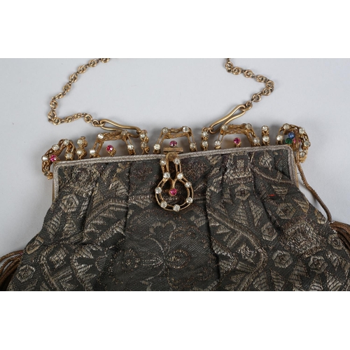 235 - Two early 20th century lamé evening bags, the first with elaborate metal frame inset with stones, ch... 