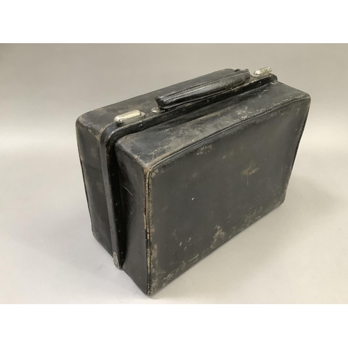 55 - A gentleman's black Gladstone dressing case, interior lined with pig skin and fitted with various gl... 