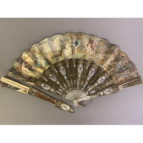 28 - Three 20th century fans: the first, in white mother of pearl, a pastiche of an 18th century fan, the... 