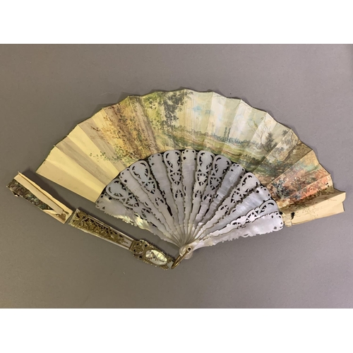 28 - Three 20th century fans: the first, in white mother of pearl, a pastiche of an 18th century fan, the... 