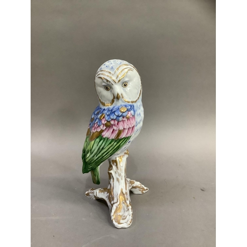 12 - A Herend style china figure of an owl perched on a branch by Vista Alegre, Portugal, painted by hand... 