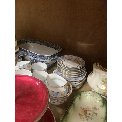 115 - A collection of ceramics comprising a musical fruit dish, cake stands, cheese dish and cover, blue a... 