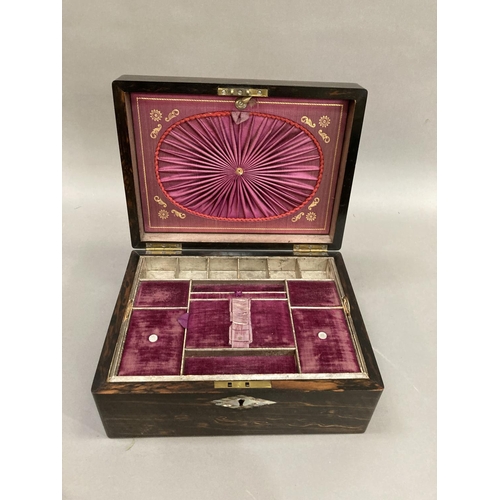 23 - A 19th century coromandel  work box inlaid with abalone cartouche and escutcheon, the interior lined... 