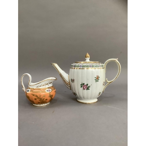 36 - An 18th century teapot, the lid having an acorn gilt finial, the fluted body of barrel shape painted... 