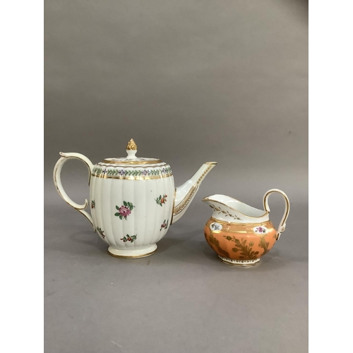 36 - An 18th century teapot, the lid having an acorn gilt finial, the fluted body of barrel shape painted... 