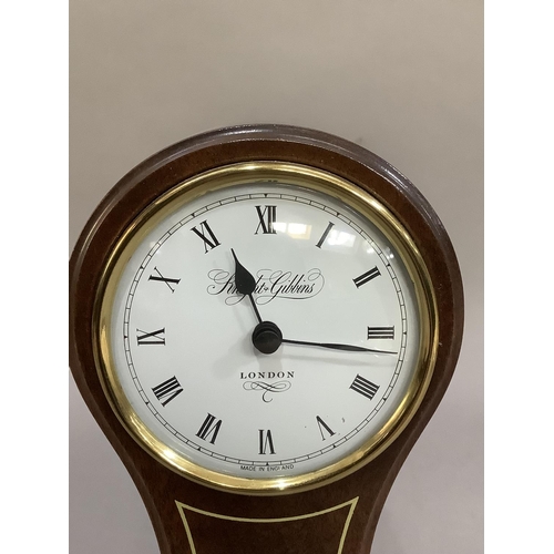 4 - A reproduction, mahogany balloon clock having a white enamelled dial signed Knight and Gibbins, Lond... 