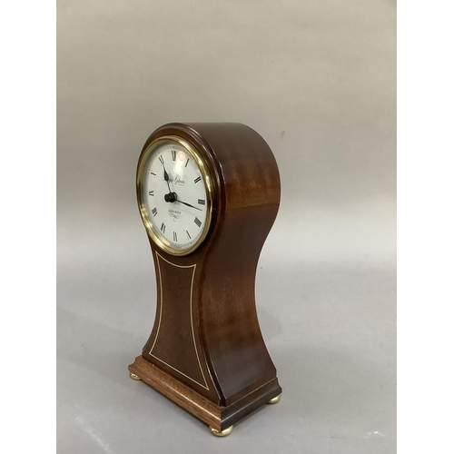 4 - A reproduction, mahogany balloon clock having a white enamelled dial signed Knight and Gibbins, Lond... 