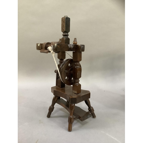 40 - A model printing press and a spinning wheel