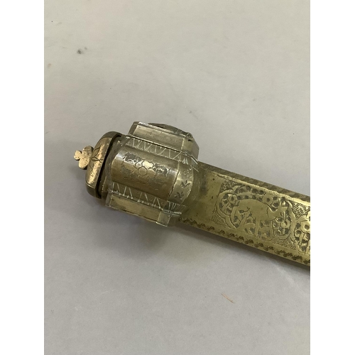 41 - A Middle Eastern brass scribe's pen and inkwell holder, 25cm long