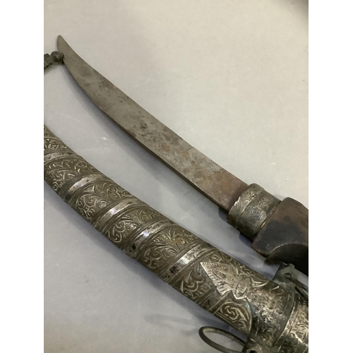 69 - An early 20th century Islamic Jambiya dagger and metal sheath