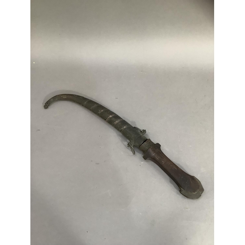 69 - An early 20th century Islamic Jambiya dagger and metal sheath