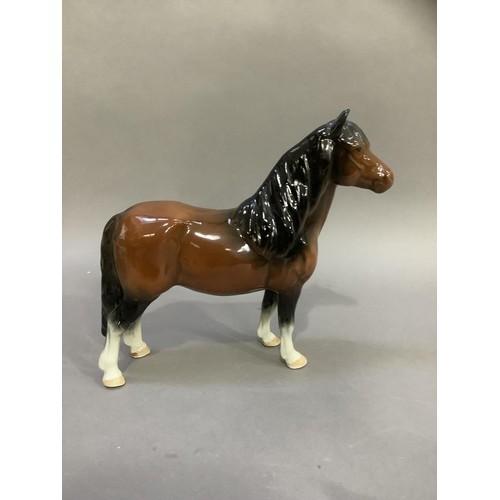 88 - A Beswick huntsman and horse, a Shetland pony and a donkey foal, a chaffinch and a robin beside a tr... 