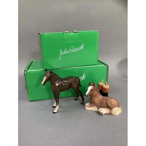 88 - A Beswick huntsman and horse, a Shetland pony and a donkey foal, a chaffinch and a robin beside a tr... 