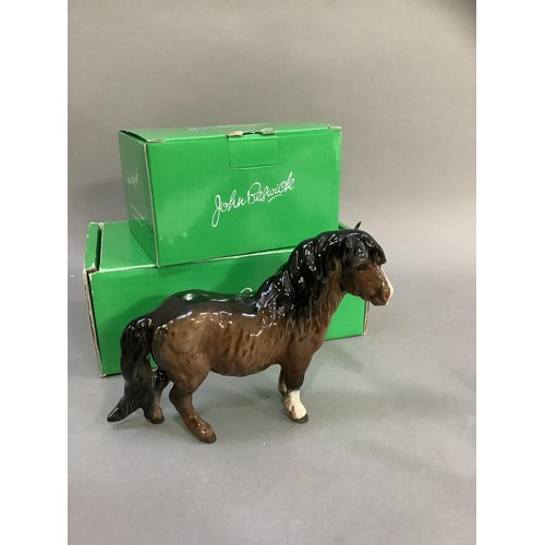 88 - A Beswick huntsman and horse, a Shetland pony and a donkey foal, a chaffinch and a robin beside a tr... 