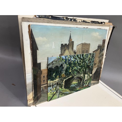 475 - A portfolio of artwork including an oil of river, bridge and trees, another of a street scene of sho... 