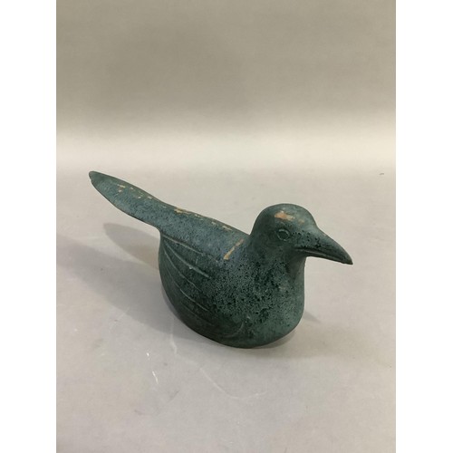 93 - A naive carving of a bird finished in sea green, 28cm long x 12cm high