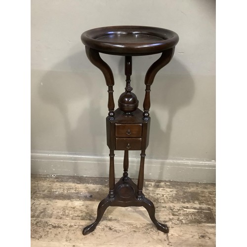 423 - A reproduction mahogany wig stand with two drawers