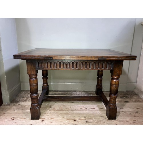 430 - A Titchmarsh and Goodwin oak drawer leaf extending dining table on turned legs joined by an 'H' stre... 