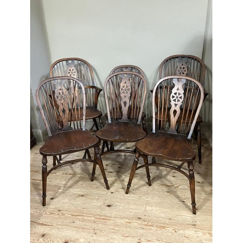 431 - A set of six wheel back dining chairs comprising two carvers and four singles