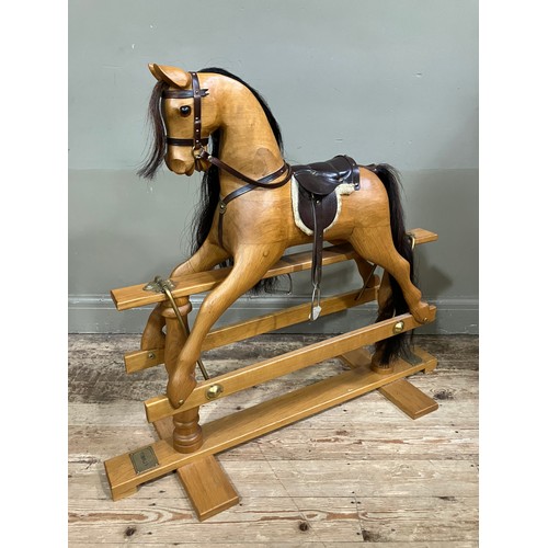 449 - A child's beech rocking horse by White Horse Company on turned pillars and cross platform stretchers... 