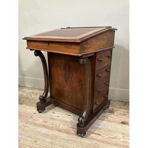 459 - A Victorian walnut Davenport having a fall front, four drawers to the side and four dummy drawers to... 