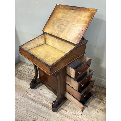 459 - A Victorian walnut Davenport having a fall front, four drawers to the side and four dummy drawers to... 