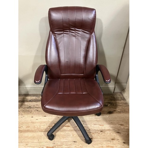 467 - A swivel office chair in burgundy leather effect upholstery