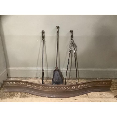 468 - A set of 19th century steel fire irons and a steel curb of serpentine outline and pierced decoration... 