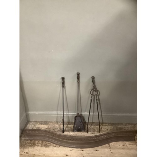 468 - A set of 19th century steel fire irons and a steel curb of serpentine outline and pierced decoration... 