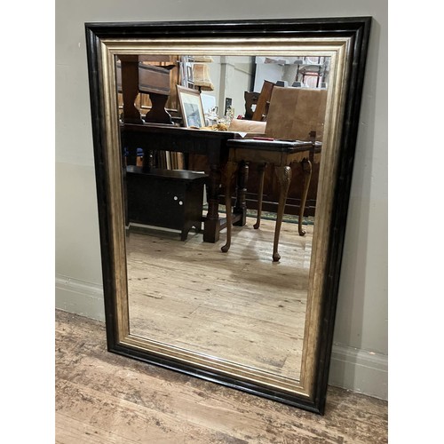 470 - A black and pale gilt framed contemporary rectangular wall mirror, 104cm x 76cm