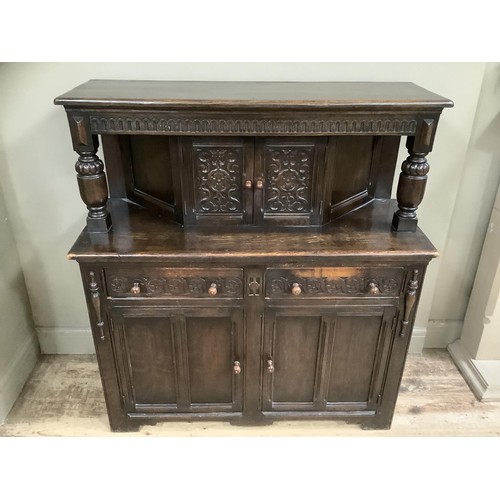 477 - A mid 20th century oak court cupboard, 122cm wide, 134cm high