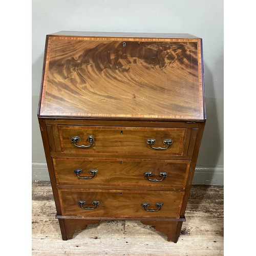 489 - An Edwardian inlaid bureau having fall front over three graduated drawers and bracket feet, 61cm wid... 